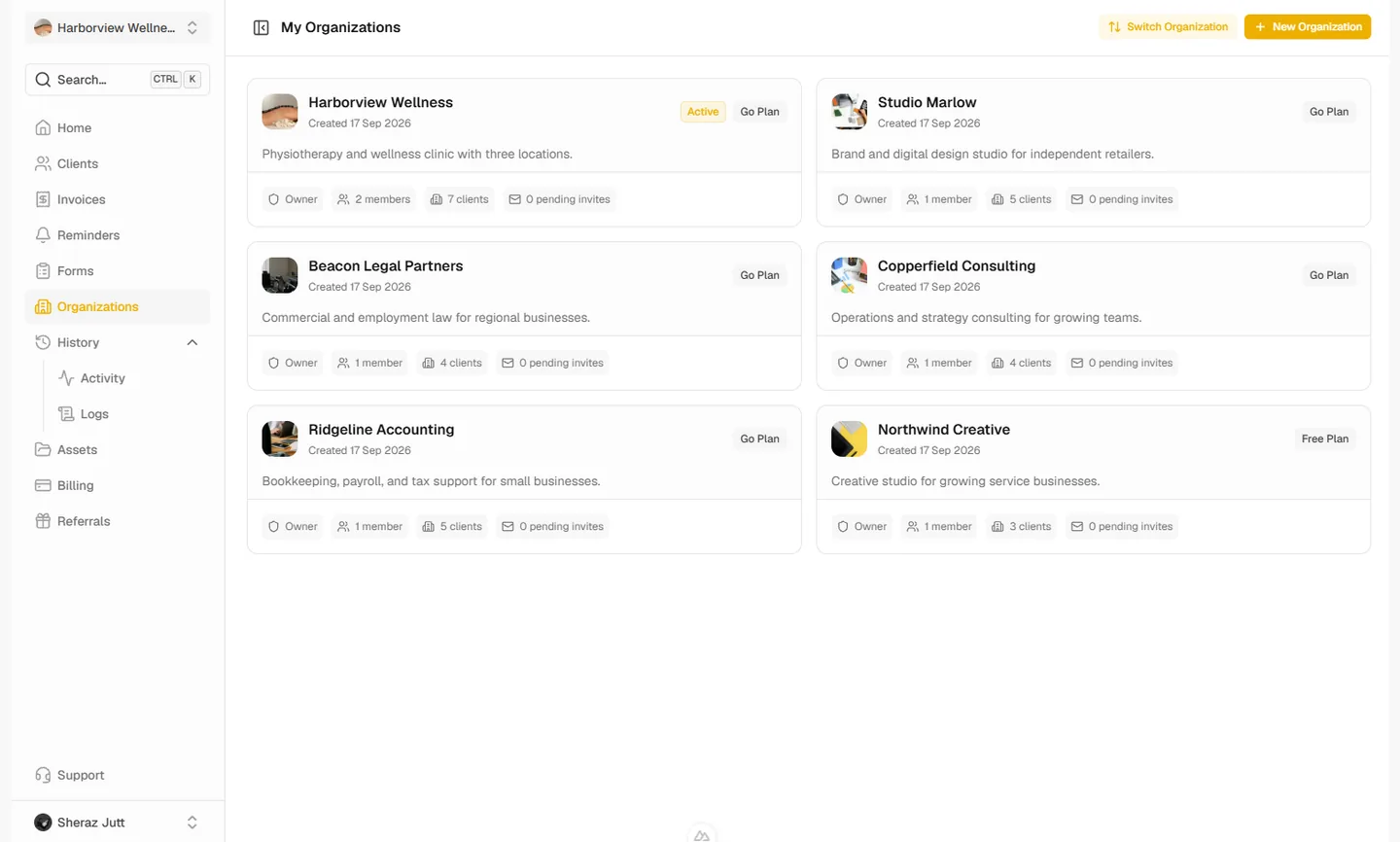 Organization list showing each workspace with its plan, members, clients, and pending invitations
